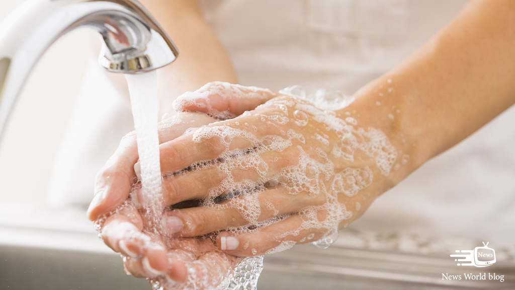  person washing their hands with clear water and soap, creating a good lather: Crystal Clear Water Solutions